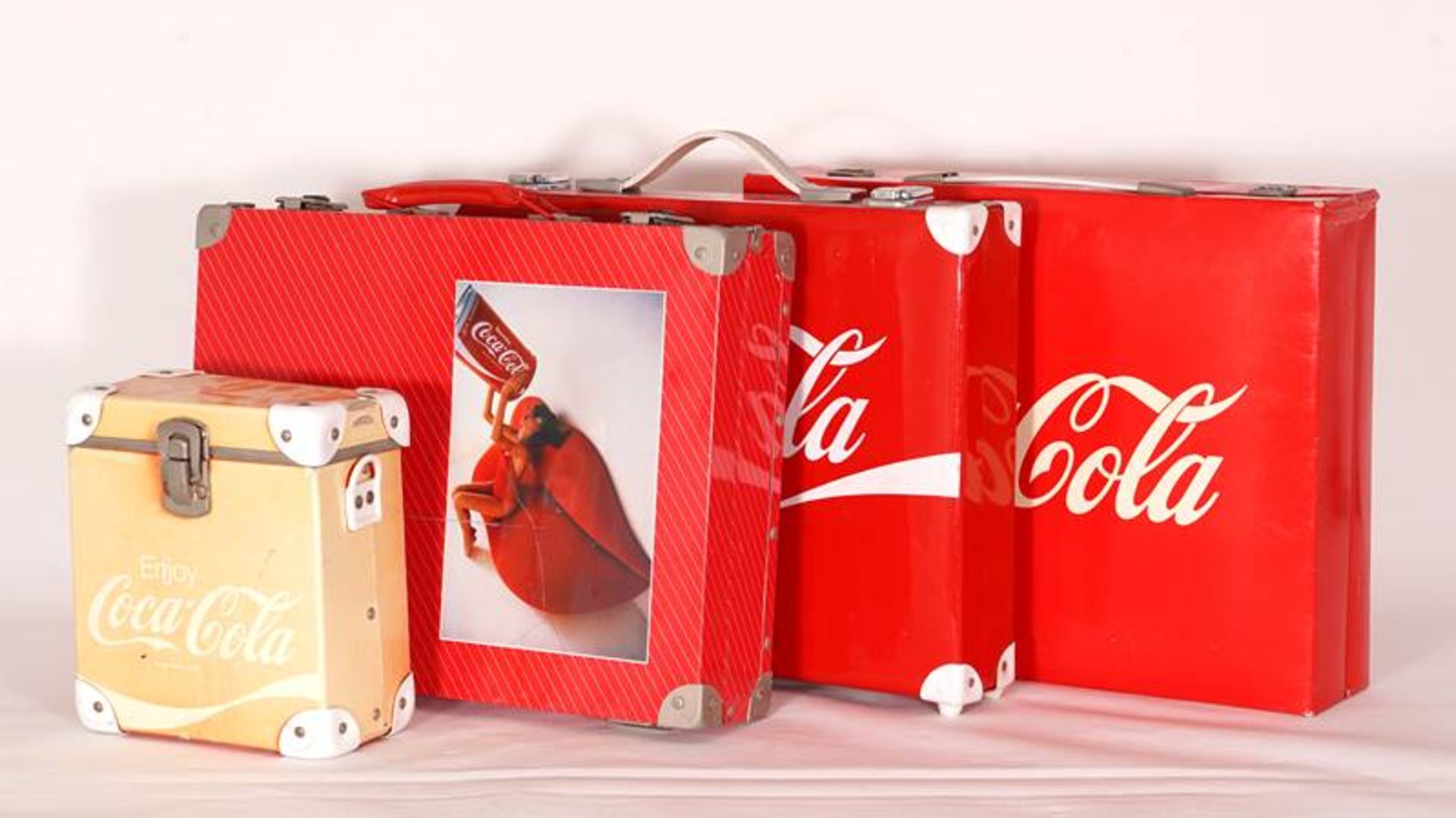 Four Coca-Cola suitcases