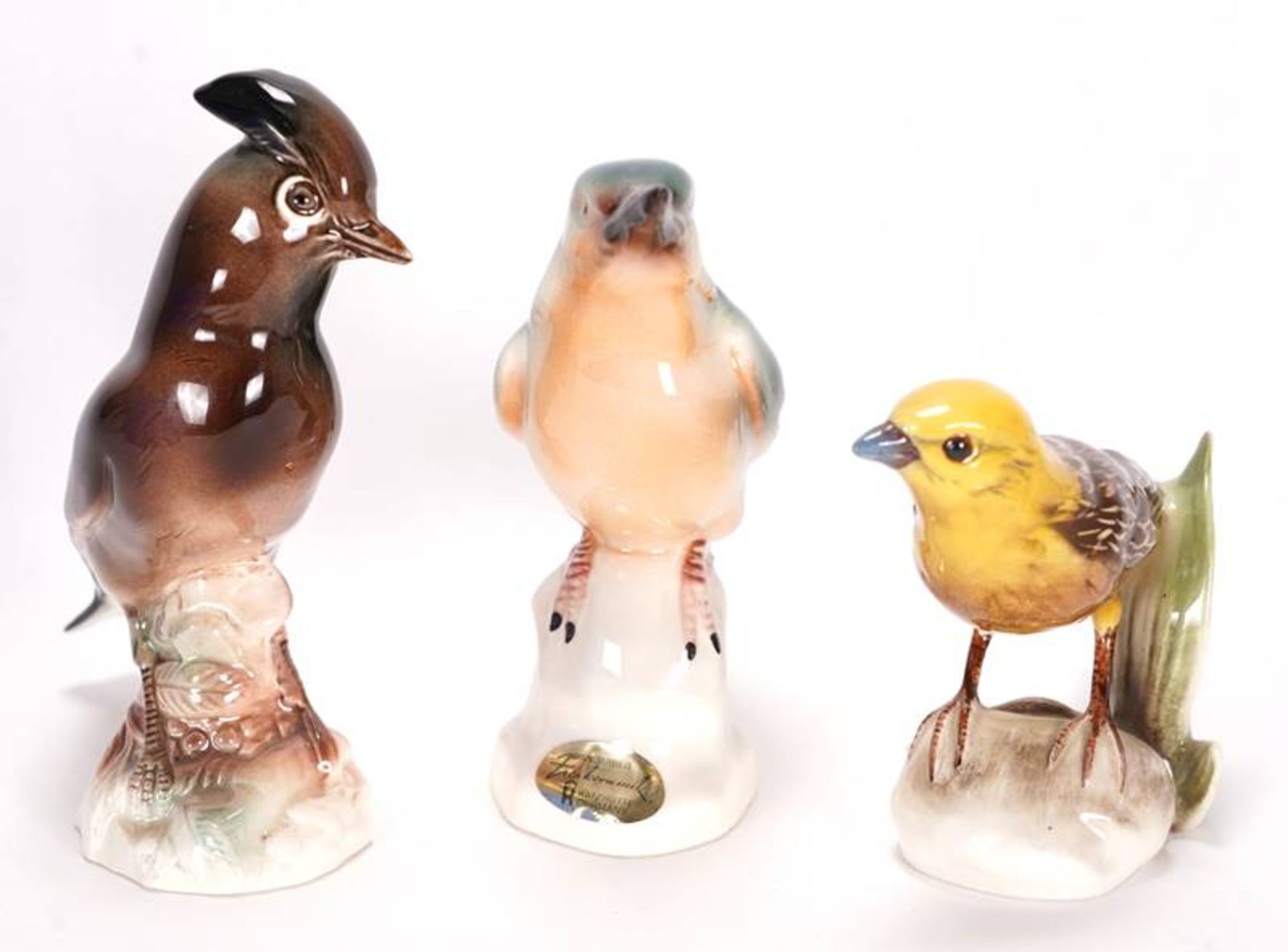 Three bird figurines