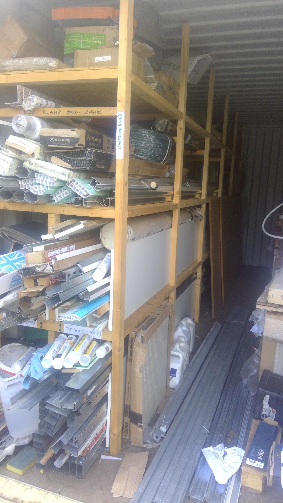 Contents of left hand shelving in container to include bump stop rails, trunking, suspended