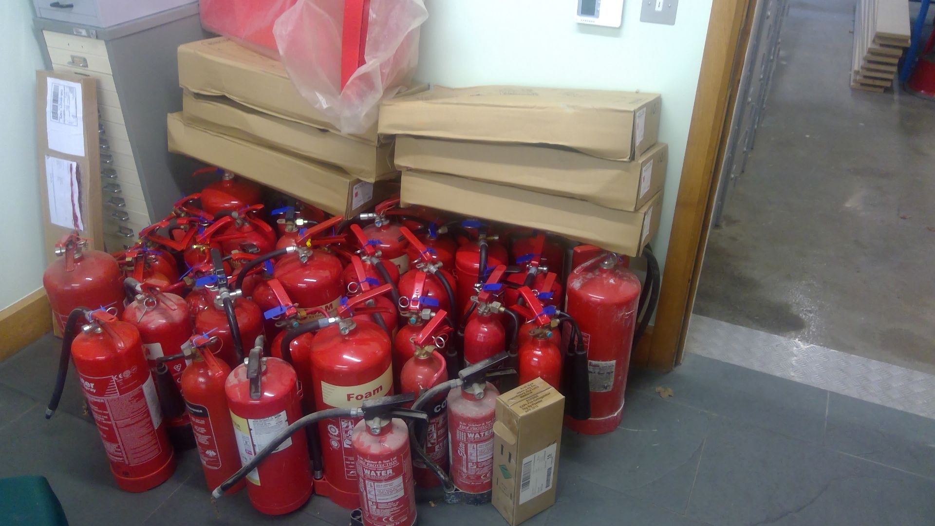 Approx 40 Assorted fire extinguishers complete with 7 new stands