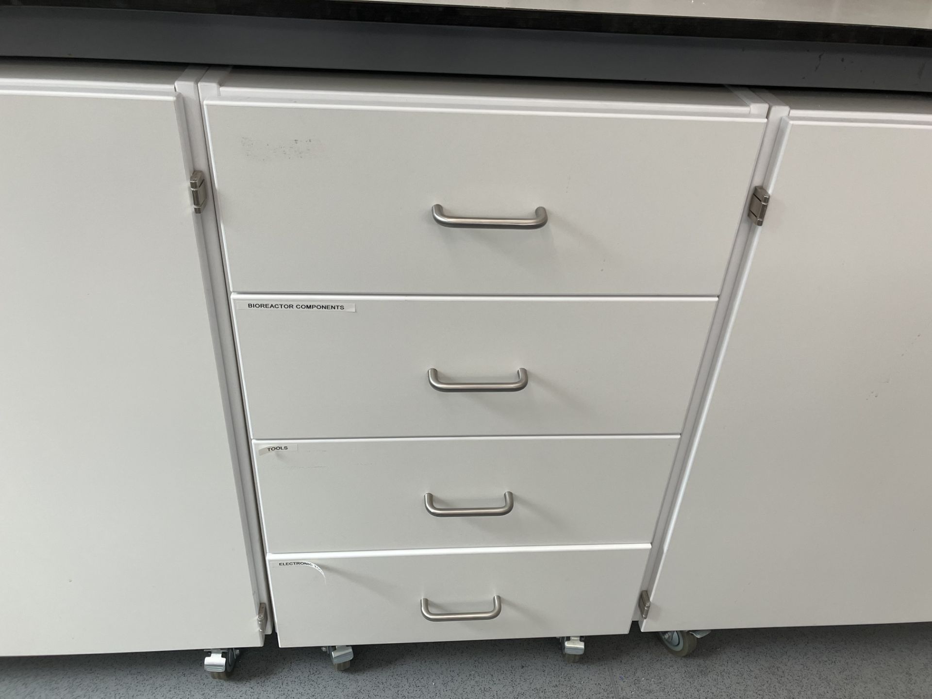 Mobile four drawer chest and contents As lotted