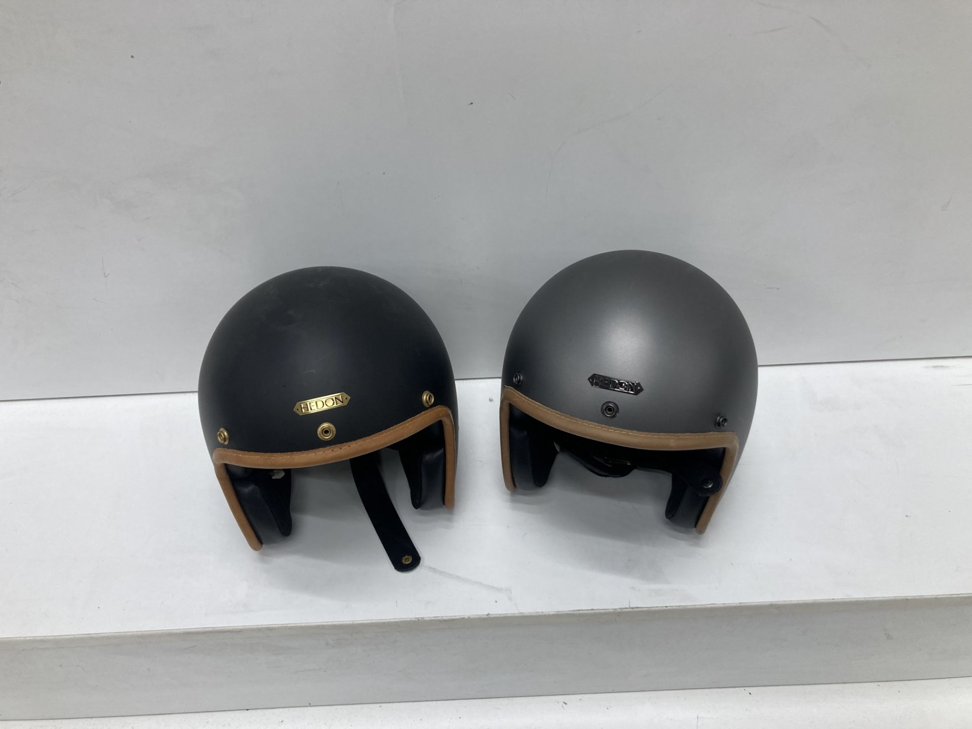 A pair of Hendon motorcycle helmets