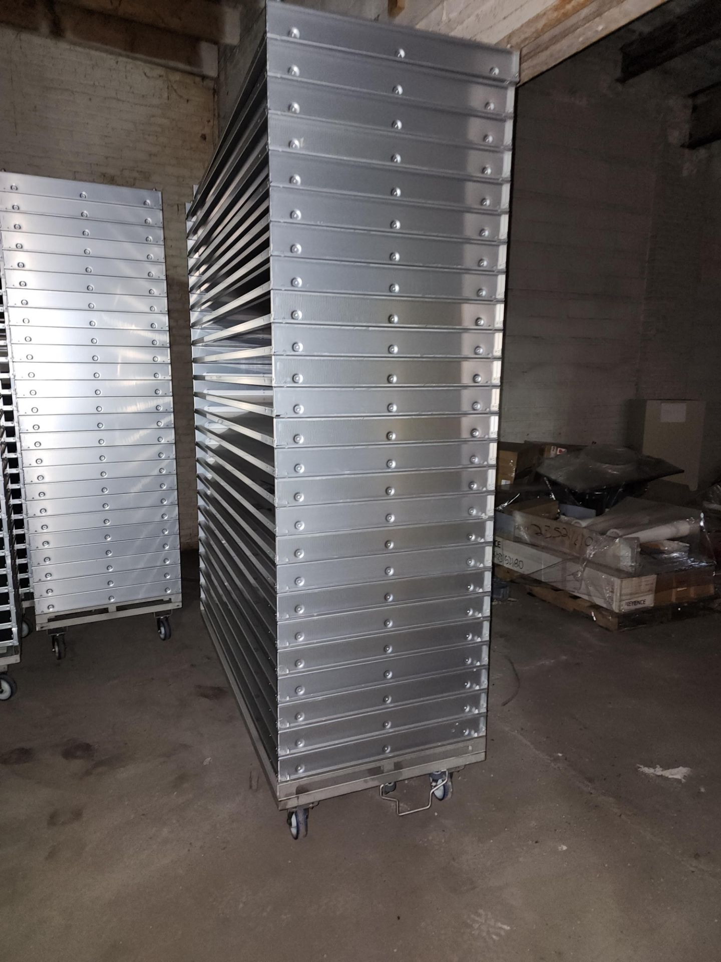 Stack of (25) Aluminum Trays, non-perforated, on Transport cart