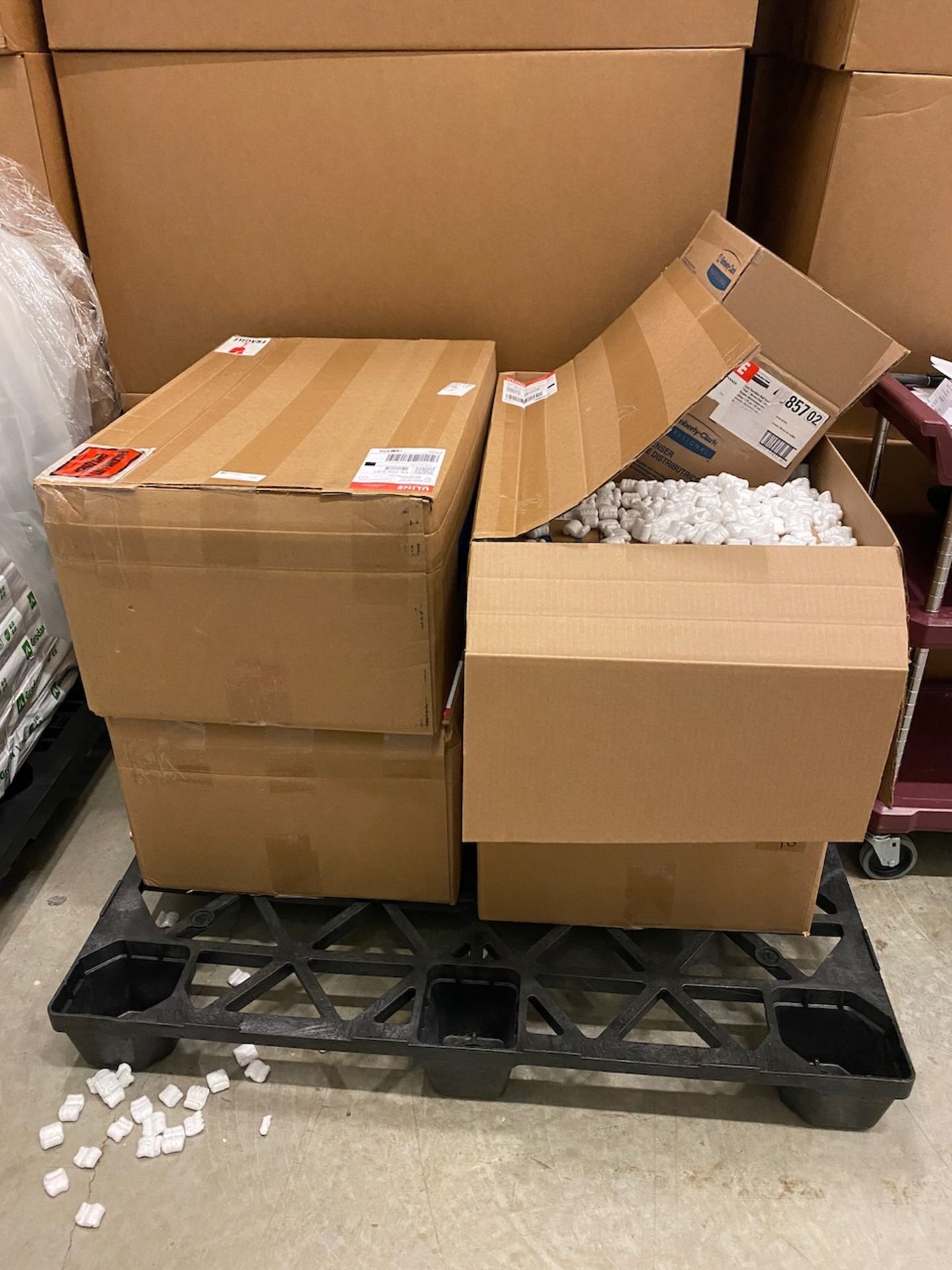 Pallet of Uline automatic paper towel dispensers.