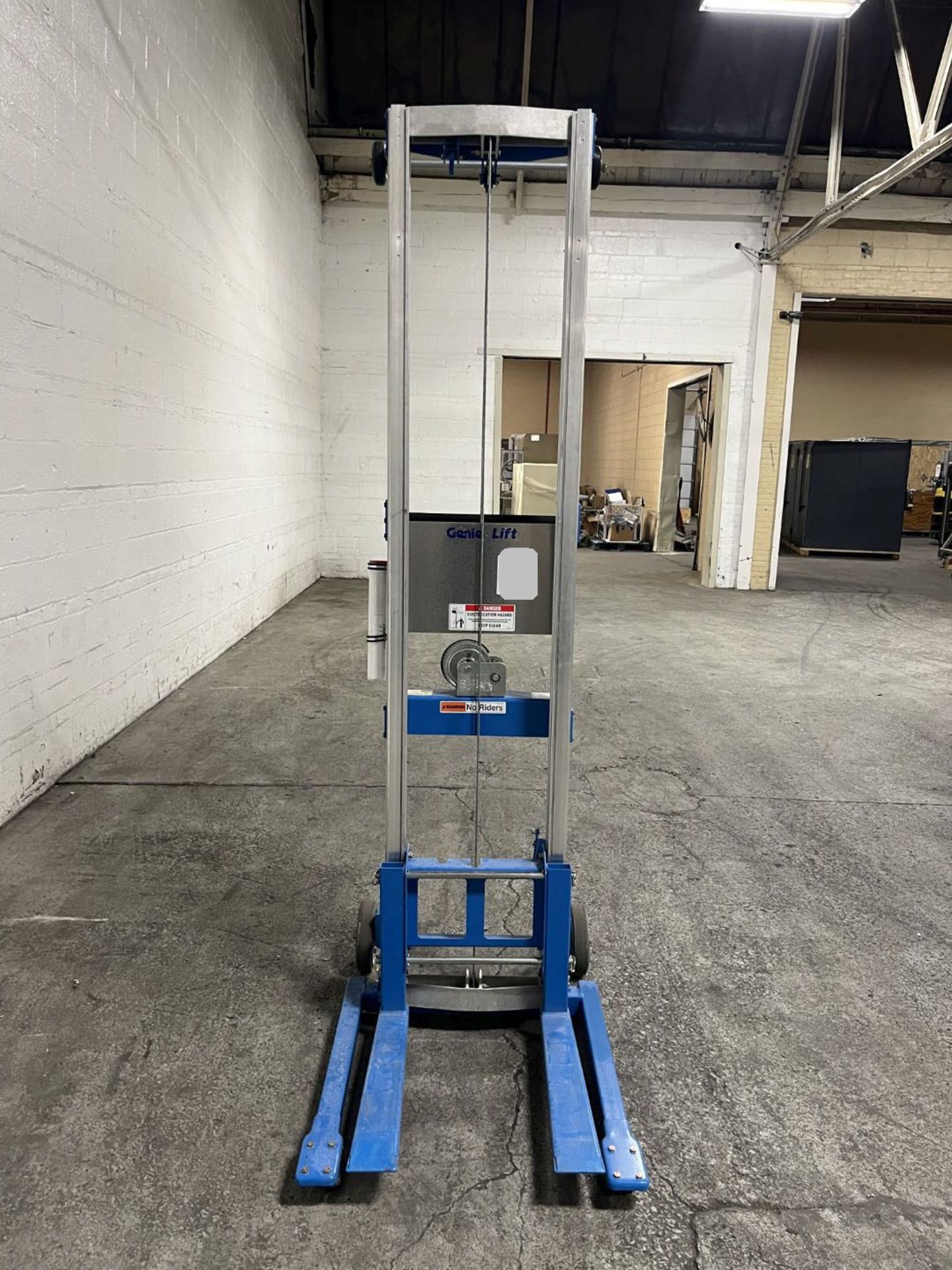 Genie lift, model GL-12, 350 lbs. capacity, approximately 66" max lift, with forks, serial# GL10-