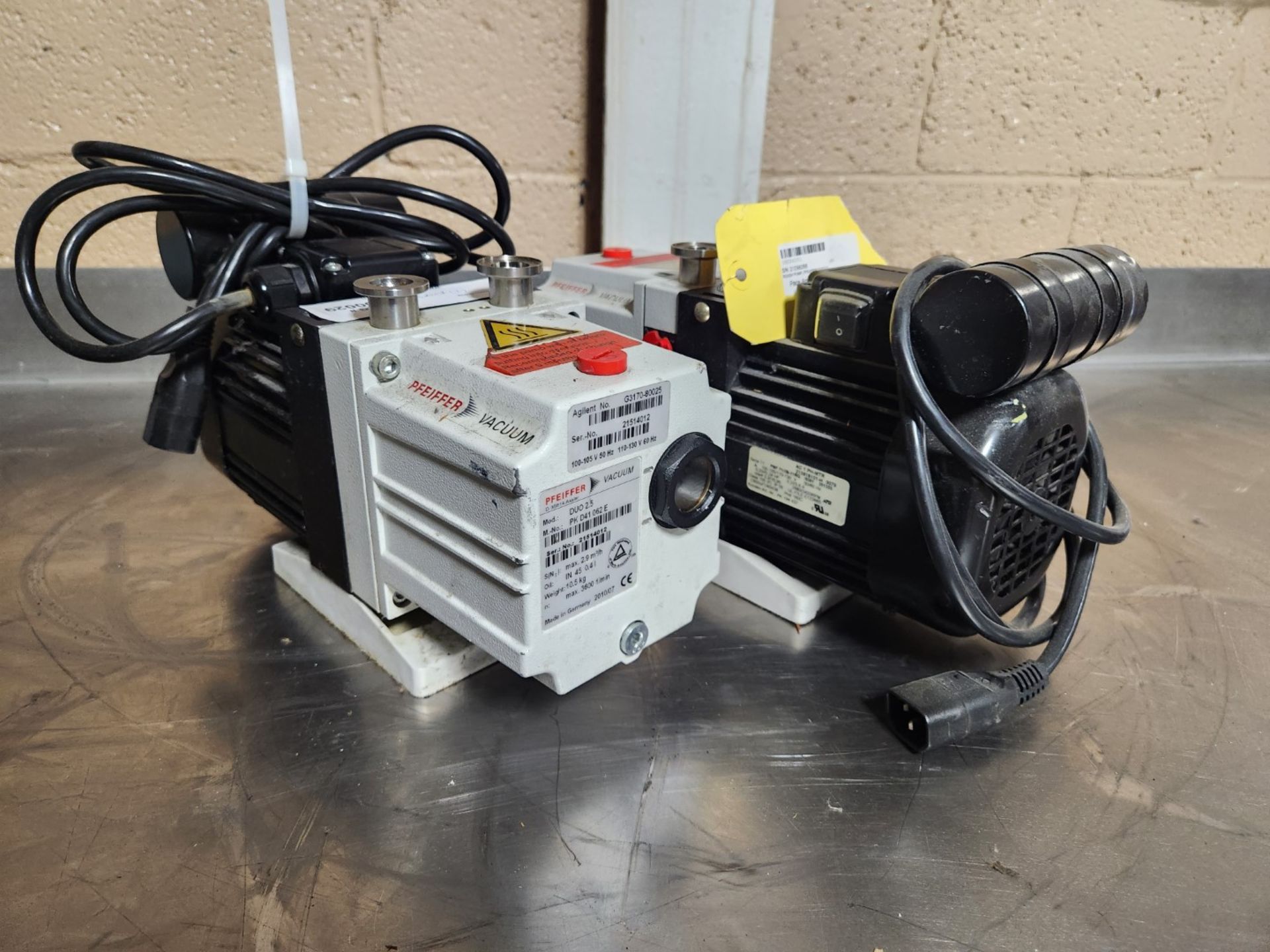 Lot of (2) Pfeiffer vacuum pumps, model DUO 2.5, 110 volts, serial#s 21514012 & 21298288. {TAG: