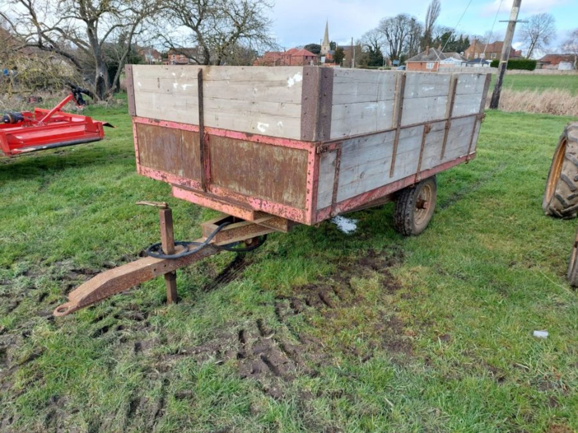 Small wooden farm trailer with grain sides