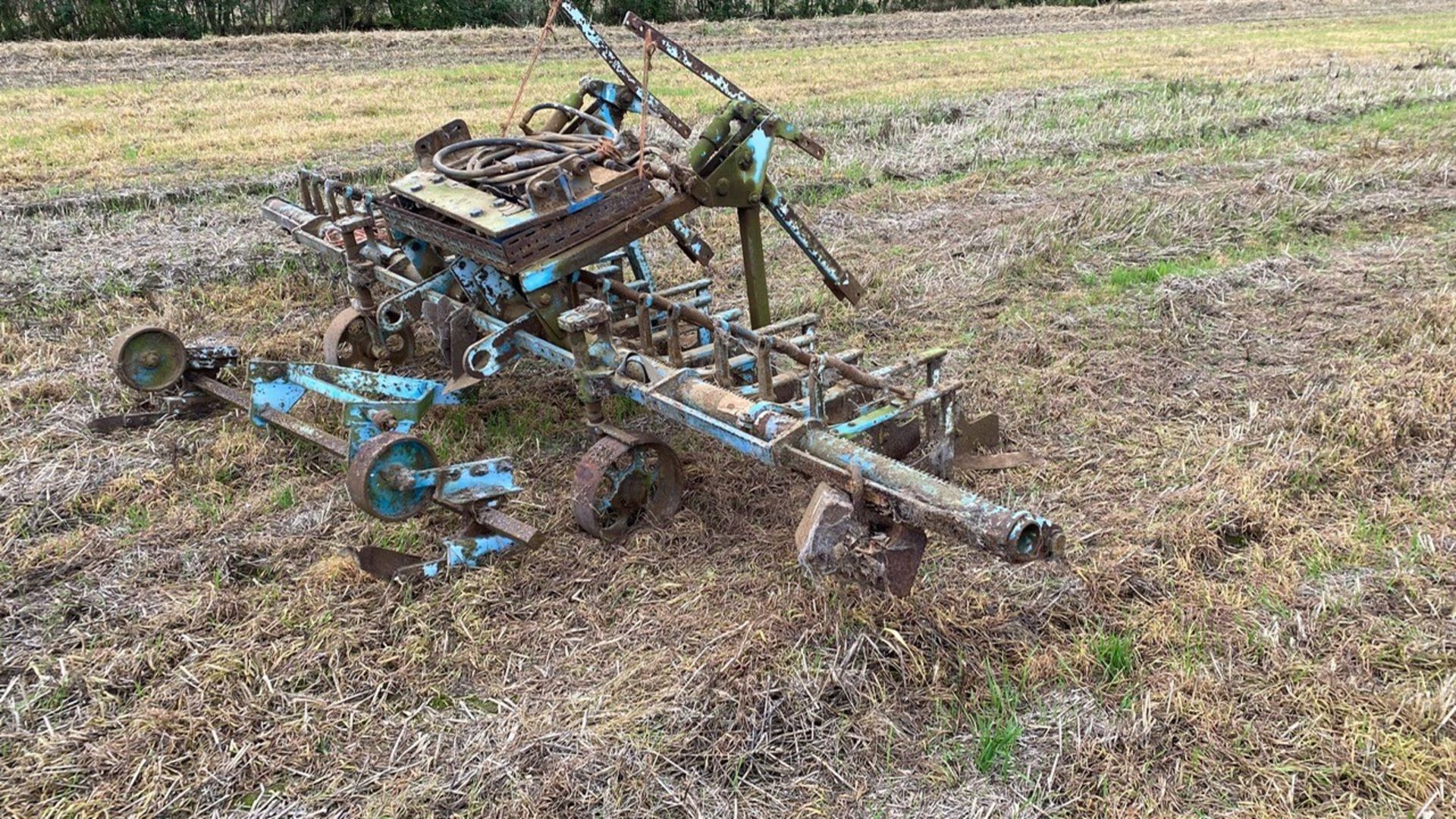 Front mounted steerage hoe with eradicator bar