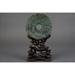 Jade disc with wooden base