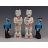 Four porcelain statues