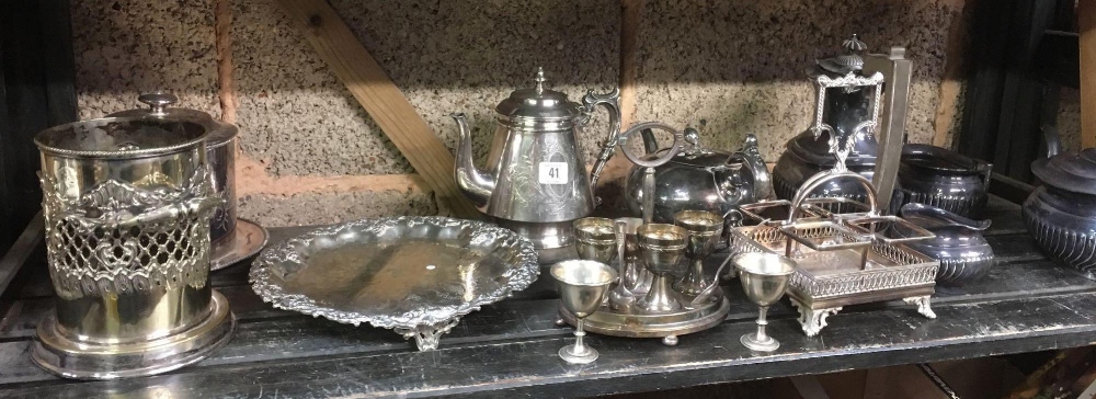 SHELF WITH MISC PLATEDWARE INCL; BISCUIT BARREL, EGG CUP SET, CRUET RACK, TEA POT, SUGAR BOWLS,