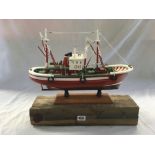 MODEL OF FISHING BOAT ON WOOD BASE