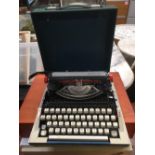 IMPERIAL 220 PORTABLE TYPEWRITER IN CASE