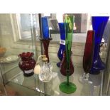 SHELF OF BLUE & RED GLASS BUD VASES