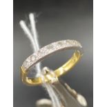 A DIAMOND HALF ETERNITY RING SET IN 18ct GOLD,