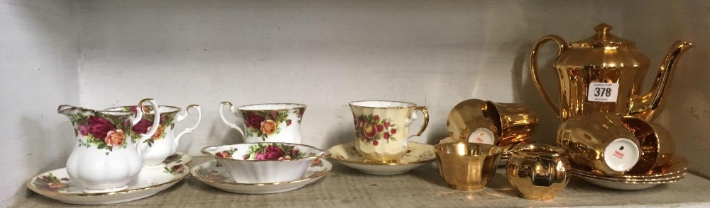 GOLD COLOURED WADE COFFEE SET & A ROYAL ALBERT TEA SET & ELIZABETHAN CUPS & SAUCERS