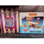 A PENNY PUSHER TOY FROM THE FAIRGROUND COLLECTION & A BOXED BUILD A PLANE