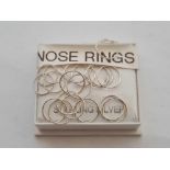 BOX OF SILVER NOSE RINGS