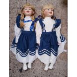 2 LARGE DOLLS DRESSED IN BLUE & WHITE UNIFORM STYLE DRESSES