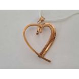 A LARGE 9ct MODERN DESIGN HEART SHAPED PENDANT