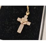 A BOXED DIAMOND CROSS SET IN 9ct WITH CHAIN