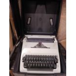 AN ADLER GABRIELE 25 PORTABLE TYPEWRITER IN CASE