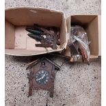 CARTON WITH PARTS FOR A CUCKOO CLOCK