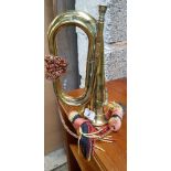 BRASS BUGLE WITH A ROYAL ARTILLERY BADGE BUGLE WITH SLIGHT DENTS