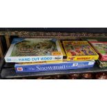 SHELF WITH MISC JIGSAW PUZZLES & VINTAGE GAMES, SCRABBLE,