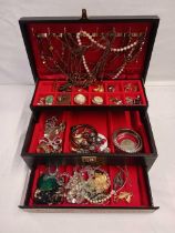 A LARGE FITTED BOX OF DRESS JEWELLERY