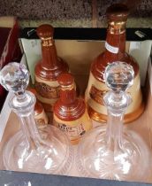 CARTON WITH WADES GRADUATED BELLS WHISKY DECANTERS & 2 GLASS DECANTERS