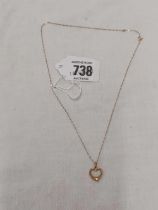 A 9ct HEART SHAPED PENDANT ON 9ct FINE NECK CHAIN