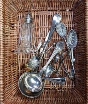 WICKER BASKET WITH MISC PLATEDWARE & A GLASS BODY SUGAR CASTER