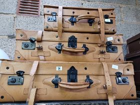 SET OF LOOK A LIKE LEATHER GRADUATED SUITCASES,