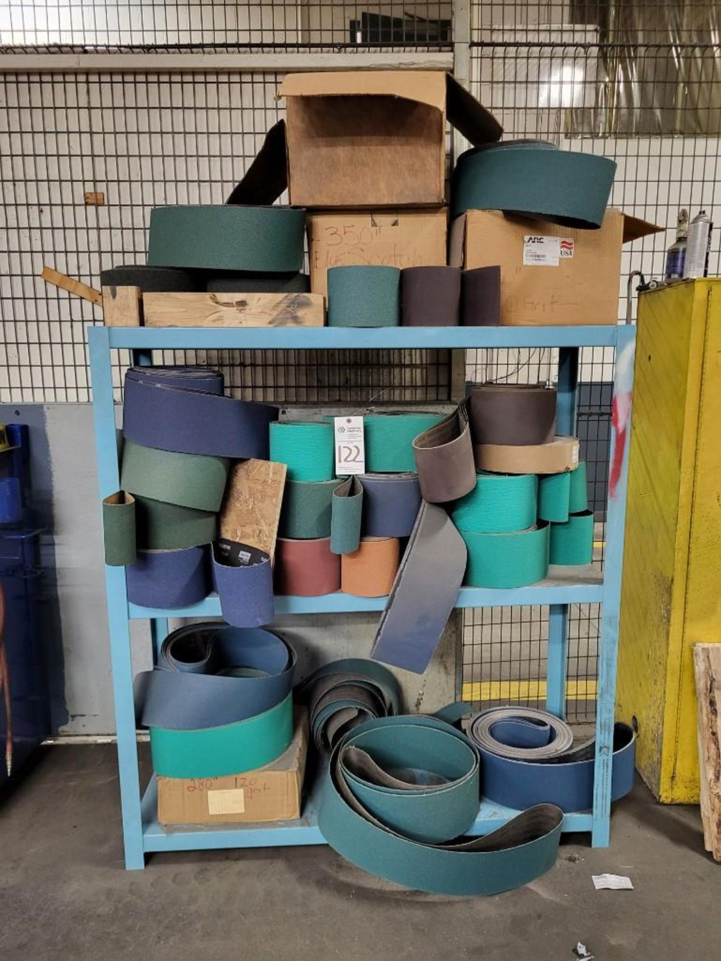 ASSORTED SANDING BELTS WITH BLUE SHELF