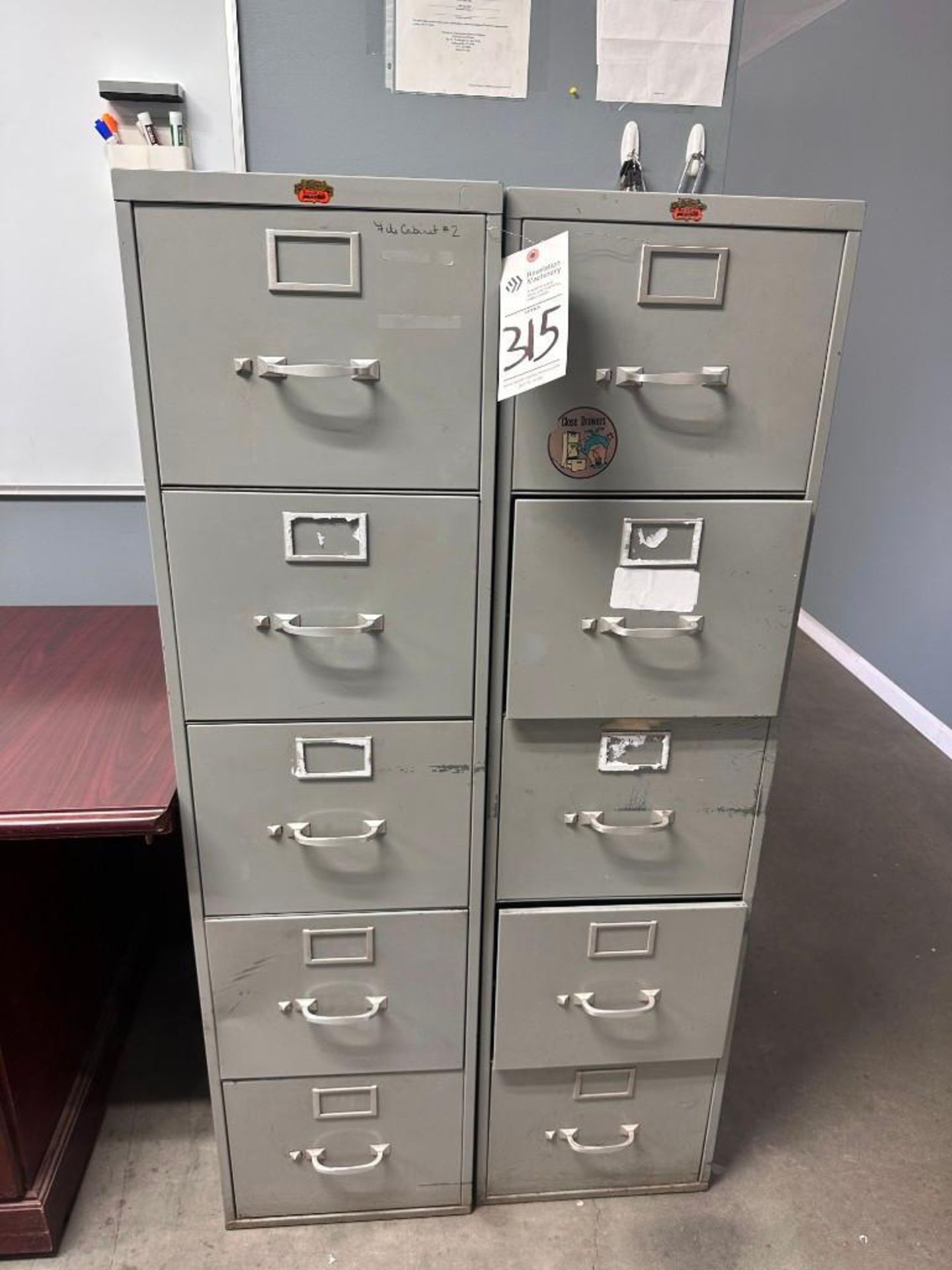 (2) FOUR DRAWER STEEL FILING CABINETS