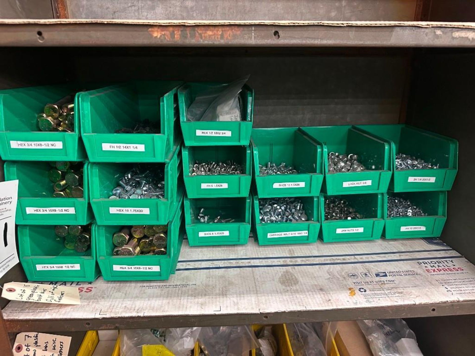 LOT OF GREEN BINS FULL OF SORTED HARDWARE