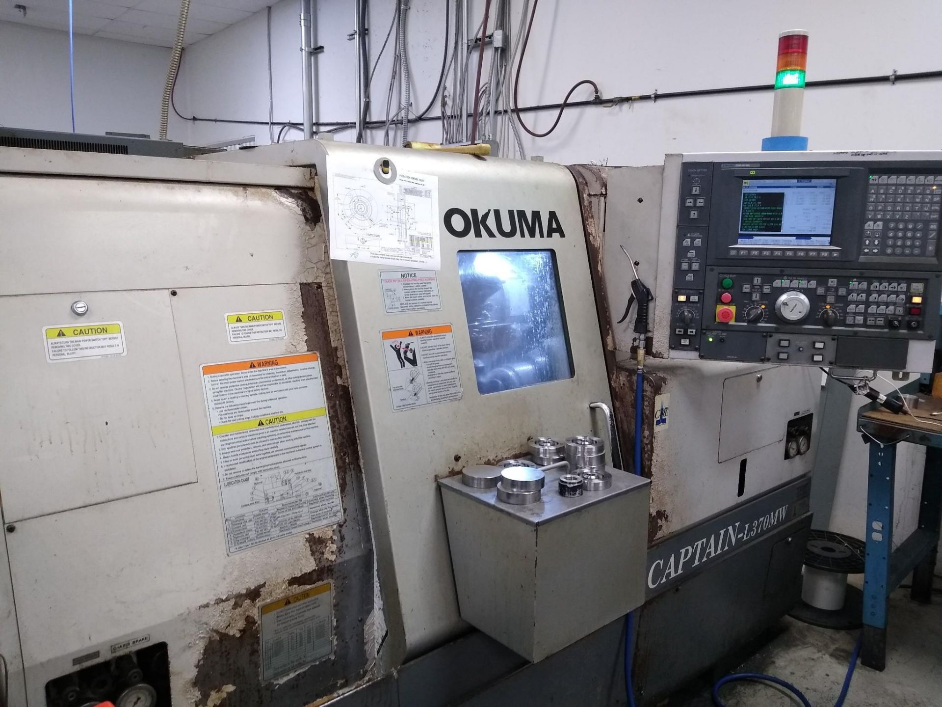 OKUMA CAPTAIN L370MW CNC TURNING CENTER WITH SUB SPINDLE LIVE TOOLING; 2004