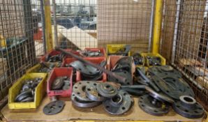 Workshop parts and supplies which include: metal flanges of multiple sizes, gaskets