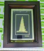 Metal lighthouse in a wooden picture frame