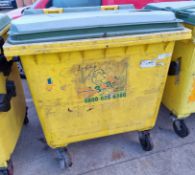 Large yellow plastic wheelie bin - dimensions: 120 x100 x130cm - crack in lid