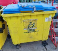 Large yellow plastic wheelie bin - dimensions: 120 x100 x130cm - cracks & missing section of lid