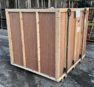 Large wooden shipping and storage container with metal shipping frame support inside