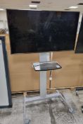 LG 49LV340C 49 inch TV on portable trolley stand