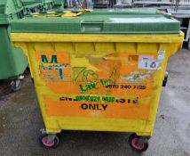 Large yellow plastic wheelie bin - dimensions: 120x100x130cm - green lid