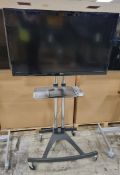 LG 47LD450 47 inch TV on portable trolley stand