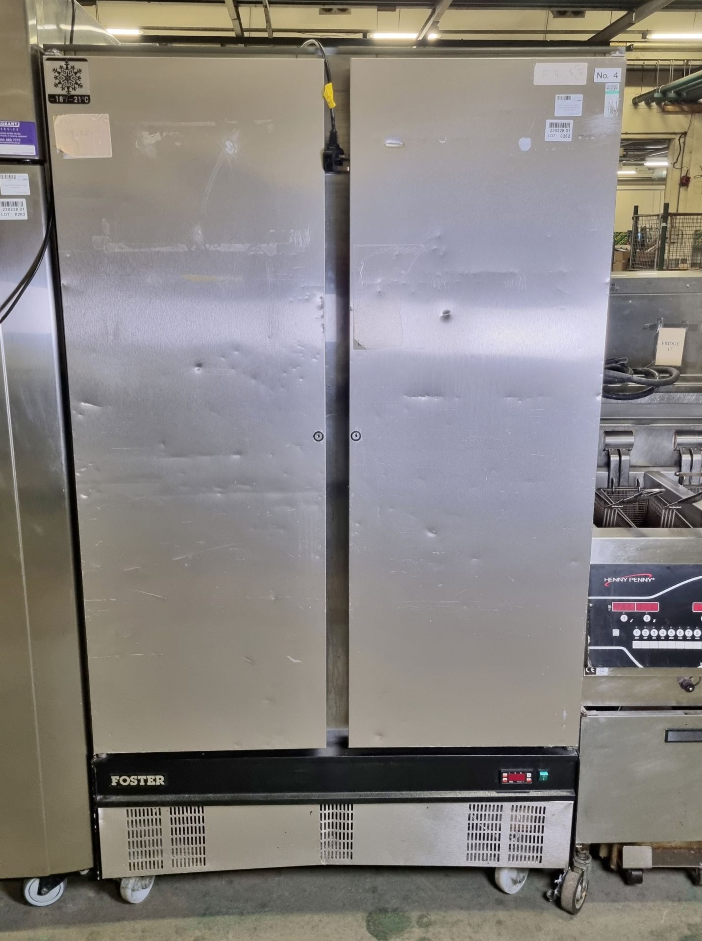 Foster double door freezer - some shelves missing and external dents