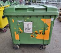 Large green plastic wheelie bin - dimensions: 120x100x130cm