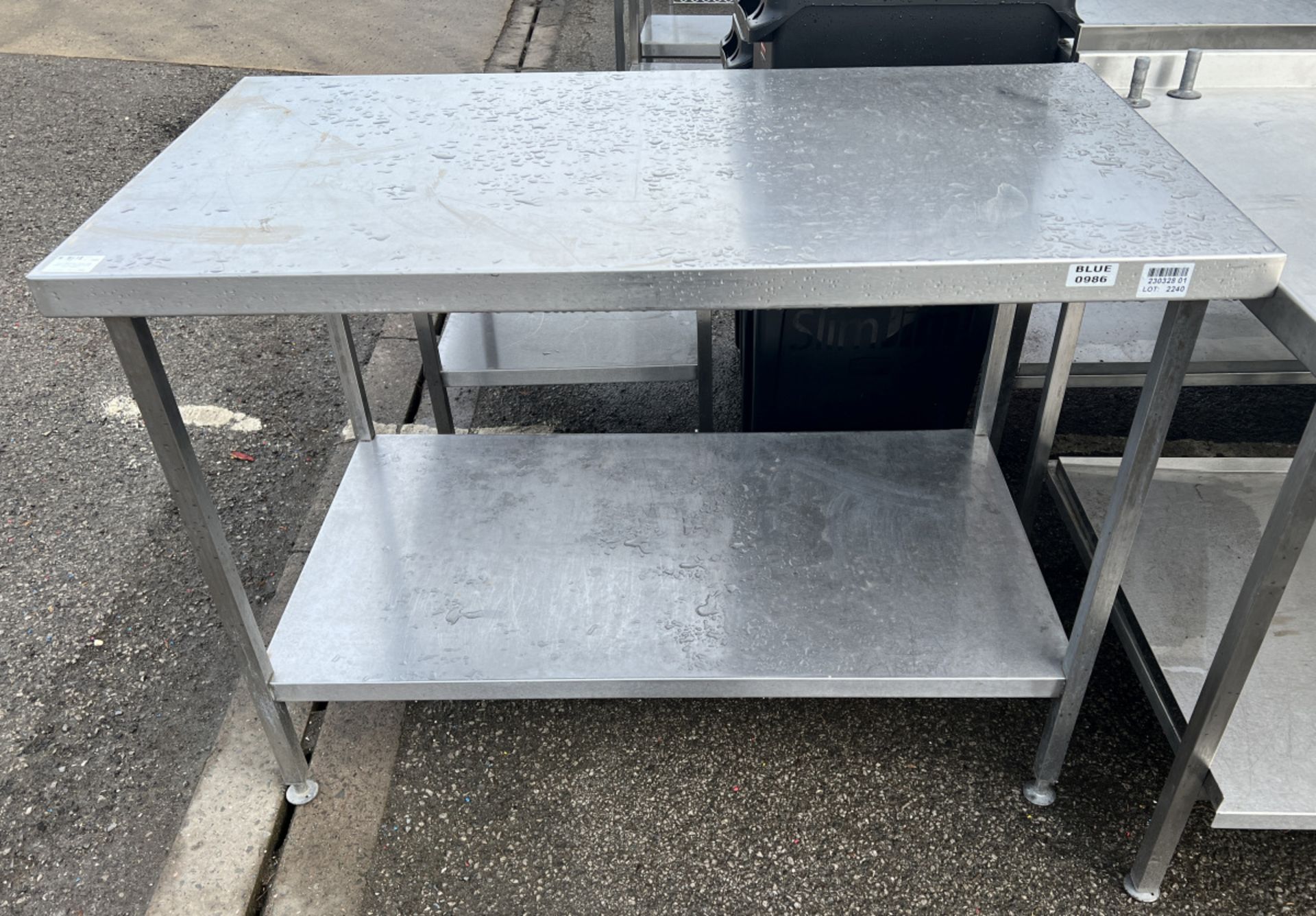 Stainless steel table with bottom shelf - dimensions: 130 x 70 x 90cm