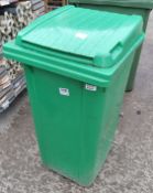 Green plastic wheelie bin with foot pedal (missing wheel) - dimensions 70 x 60 x 110cm